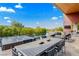 Expansive patio with outdoor dining, lounge area, and stunning pool views at 8 Meadowhawk Ln, Las Vegas, NV 89135