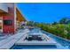 Backyard oasis with an infinity pool, fire pit lounge, and desert views at 8 Meadowhawk Ln, Las Vegas, NV 89135