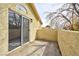 A close view of the balcony with stucco wall next to sliding doors at 8113 Bay Springs Dr, Las Vegas, NV 89128