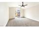 Spacious bedroom with sliding glass doors to the patio and a ceiling fan at 8113 Bay Springs Dr, Las Vegas, NV 89128