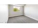 Neutral bedroom with gray carpeting, a white wall, and a window providing natural light at 8113 Bay Springs Dr, Las Vegas, NV 89128