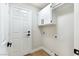 Laundry room with shelving and hanging rack at 8113 Bay Springs Dr, Las Vegas, NV 89128