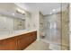Well-lit bathroom featuring dual sinks and spacious glass shower at 8255 Las Vegas Blvd # 1821, Las Vegas, NV 89123
