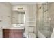 Modern bathroom features a walk-in shower with glass door, double vanity and contemporary fixtures at 8255 Las Vegas Blvd # 1821, Las Vegas, NV 89123
