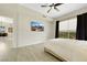 Well-lit bedroom featuring views and modern fan at 8255 Las Vegas Blvd # 1821, Las Vegas, NV 89123