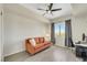 Inviting bedroom features wood-look floors, a ceiling fan, and ample natural light from the large window at 8255 Las Vegas Blvd # 1821, Las Vegas, NV 89123