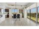 Dining area with modern chandelier, table set for four, and large windows with mountain views at 8255 Las Vegas Blvd # 1821, Las Vegas, NV 89123