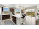 Open concept kitchen features modern appliances, center island with seating, and opens to dining area at 8255 Las Vegas Blvd # 1821, Las Vegas, NV 89123