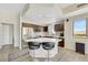 Modern kitchen with stainless steel appliances, dark cabinetry, and an island with bar seating at 8255 Las Vegas Blvd # 1821, Las Vegas, NV 89123