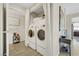 Convenient laundry area with stacked washer and dryer units, as well as some decor at 8255 Las Vegas Blvd # 1821, Las Vegas, NV 89123