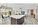 Bright living area with kitchen island, modern furniture, flat-screen TV, and mountain views at 8255 Las Vegas Blvd # 1821, Las Vegas, NV 89123