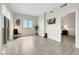 Bright living area with large windows offering mountain views, modern decor, and wood-look floors at 8255 Las Vegas Blvd # 1821, Las Vegas, NV 89123