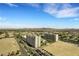 Scenic view from a high-rise balcony overlooking the buildings, city, and mountain views at 8255 Las Vegas Blvd # 1821, Las Vegas, NV 89123