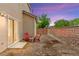 Enclosed backyard features low-maintenance landscaping and a cozy patio area perfect for relaxing or entertaining at 8316 Mokena Ave, Las Vegas, NV 89178