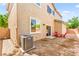 Backyard featuring a patio area and views of the home's stucco exterior at 8316 Mokena Ave, Las Vegas, NV 89178