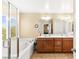 Modern bathroom with tub, separate shower, double vanity with plenty of storage at 8316 Mokena Ave, Las Vegas, NV 89178