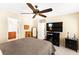 Comfortable bedroom featuring a ceiling fan, neutral colors and natural lighting at 8316 Mokena Ave, Las Vegas, NV 89178