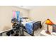 Cozy bedroom with a dark frame bed and colorful decor, including a lamp and curtains at 8316 Mokena Ave, Las Vegas, NV 89178