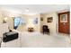 Bright, carpeted bedroom featuring a large window and neutral wall color at 8316 Mokena Ave, Las Vegas, NV 89178