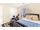 Comfortable bedroom with a dark frame bed, light colored walls, and closet for storage at 8316 Mokena Ave, Las Vegas, NV 89178
