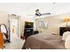 Comfortable bedroom featuring a ceiling fan, neutral colors and natural lighting at 8316 Mokena Ave, Las Vegas, NV 89178