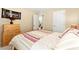 Comfortable bedroom with a wood frame bed, light colored walls, and a window at 8316 Mokena Ave, Las Vegas, NV 89178
