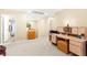 A neutral bonus room with a built-in desk and carpeted floors at 8316 Mokena Ave, Las Vegas, NV 89178