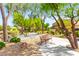 Picturesque community park with mature trees, walking paths, and comfortable bench seating at 8316 Mokena Ave, Las Vegas, NV 89178