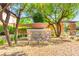 Sierra Madre community entrance, with lush landscaping and a stone monument at 8316 Mokena Ave, Las Vegas, NV 89178