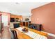 Bright dining area featuring wood floors and an open floor plan to the kitchen at 8316 Mokena Ave, Las Vegas, NV 89178