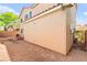 Exterior view of the two-story home showing stucco, wall, and ground landscaping at 8316 Mokena Ave, Las Vegas, NV 89178