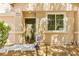 Inviting home exterior features a decorative front door, manicured landscaping and stone accents at 8316 Mokena Ave, Las Vegas, NV 89178