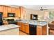 Beautiful kitchen features granite countertops, dark cabinets, and modern appliances at 8316 Mokena Ave, Las Vegas, NV 89178