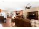Open-concept living room with natural light, wood floors, comfortable furnishings, and seamless flow to the kitchen at 8316 Mokena Ave, Las Vegas, NV 89178