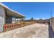 Wide backyard with partial landscaping, rock, artificial turf, and a covered patio at 842 Envoy Cir, Henderson, NV 89002