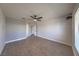 Bright bedroom with a ceiling fan, wood-look floors, and access to other rooms at 842 Envoy Cir, Henderson, NV 89002