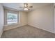 Inviting bedroom featuring a bright window, carpet, and neutral paint at 842 Envoy Cir, Henderson, NV 89002