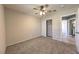 Bedroom featuring a ceiling fan, sliding closet doors, and doorway to the bathroom at 842 Envoy Cir, Henderson, NV 89002
