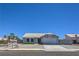 Charming single-story home with a well-manicured front yard and attached two-car garage at 842 Envoy Cir, Henderson, NV 89002