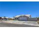 Single-story house with desert landscaping, driveway, and a two-car garage at 842 Envoy Cir, Henderson, NV 89002