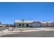 Well-kept single-story home featuring a low-maintenance front yard and a two-car garage at 842 Envoy Cir, Henderson, NV 89002