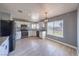 Updated kitchen features granite countertops, stainless steel appliances, and ample cabinet space at 842 Envoy Cir, Henderson, NV 89002