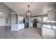 Updated kitchen with stainless steel appliances, granite countertops, and a breakfast bar at 842 Envoy Cir, Henderson, NV 89002