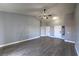 Bright living room features wood-look floors, vaulted ceilings, and neutral color scheme at 842 Envoy Cir, Henderson, NV 89002