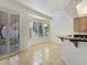 Bright dining area with natural light, tile floor and breakfast bar at 8981 Rivers Edge Dr, Las Vegas, NV 89117