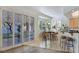 Bright dining area featuring tile floors and doors leading to the patio at 8981 Rivers Edge Dr, Las Vegas, NV 89117