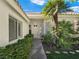 Inviting front entrance featuring a well-maintained walkway and vibrant landscaping at 8981 Rivers Edge Dr, Las Vegas, NV 89117