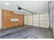Spacious garage with ample storage cabinets and an automatic door opener at 8981 Rivers Edge Dr, Las Vegas, NV 89117