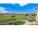 Scenic view of the lush green golf course with water features and mountain views at 8981 Rivers Edge Dr, Las Vegas, NV 89117