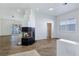 Spacious living room with wood floors, open layout, modern fireplace, and abundant natural light at 8981 Rivers Edge Dr, Las Vegas, NV 89117
